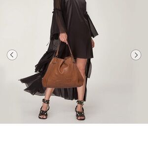 Authentic Coach Edie large brown leather purse.